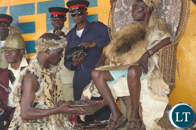 Paramont Chief Mpezeni is been given roasted meat during the 2016 Nc`wala traditional ceremony in Chipata