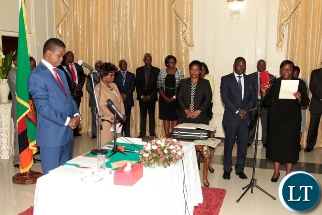 President Edgar Lungu listens to the orth from newly appointed Constitutional Court President justice Hildah Chibomba at State House
