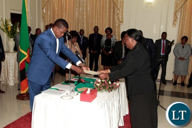 -President Edgar Lungu receive the orth from newly appointed Constitutional Court President justice Hildah Chibomba at State House