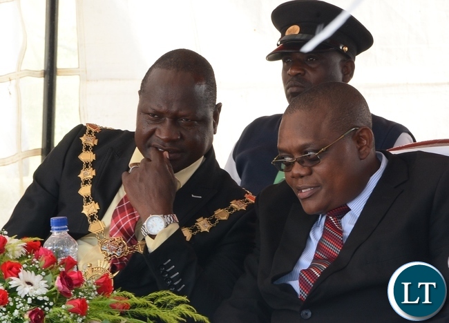 Lusaka Mayor George Nyendwa(r) chats with Lusaka Province Medical Officer Kennedy Malama(l) shotly before handing over the Medical Equipments to Chifundo Clinic in Chaisa Compound