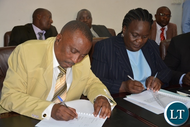 Permanent Secretary for Minister of Youth sports and child development Ms Agnes Musunga sings the memorandum of street vendors with the President of Street Vendors Association Mr Teddy Sinkala Permanent Secretary for Minister of Youth sports and child development Ms Agnes Musunga sings the memorandum of street vendors with the President of Street Vendors Association Mr Teddy Sinkala