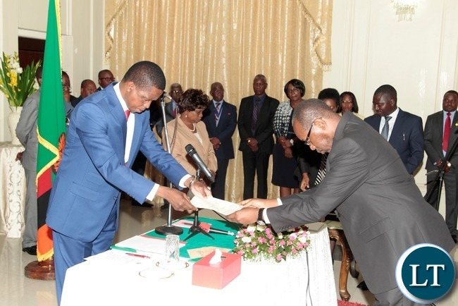 President Edgar Lungu receive the orth from newly appointed Constitutional Court judge Justice Enock Mulembe at State House