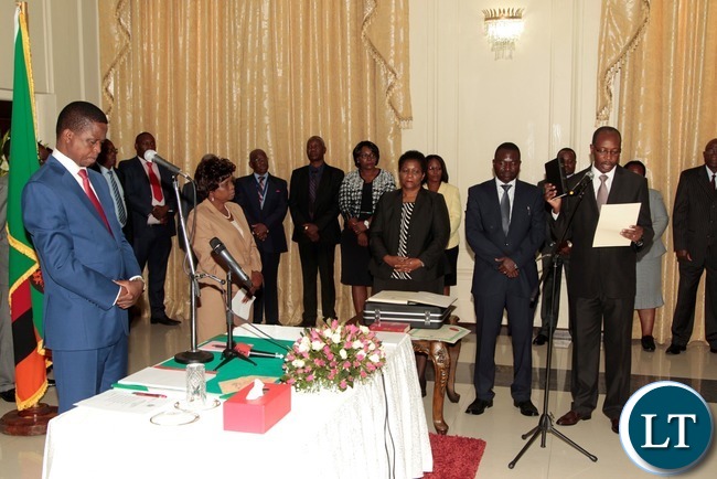 President Edgar Lungu listens to the orth from newly appointed Constitutional Court judge justice Justice Enock Mulembe at State House