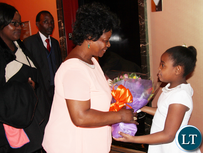 First Lady of Zambia Mrs. Esther Lungu receiving a bouquet of flowers from Vanessa Brown Mwanza on arrival in New York. The First Lady will participate in the 60th Session of the Commission on the Status on Women at UN Headquarters. PHOTO | Chibaula D. Silwamba | Zambia UN Mission