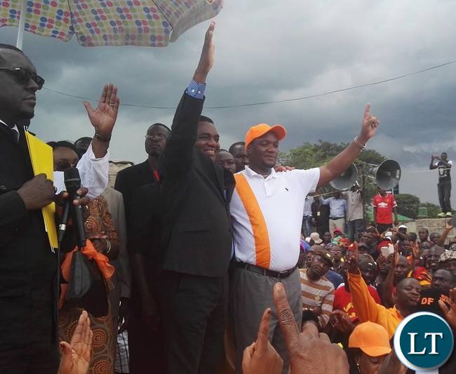 UPND leader Hakainde Hichilema and Democratic Front leader Miles Sampa gesture to their supporters who came to witness the signing of an election pact between UPND and DF. UPND leader Hakainde Hichilema and Democratic Front leader Miles Sampa gesture to their supporters who came to witness the signing of an election pact between UPND and DF.