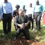 Agriculture Minister  Given Lubinda positioning himself to plant an acacia tree to flag off the Hope Lilayi Women’s club tree planting initiative in Lusaka’s Lilayi Area