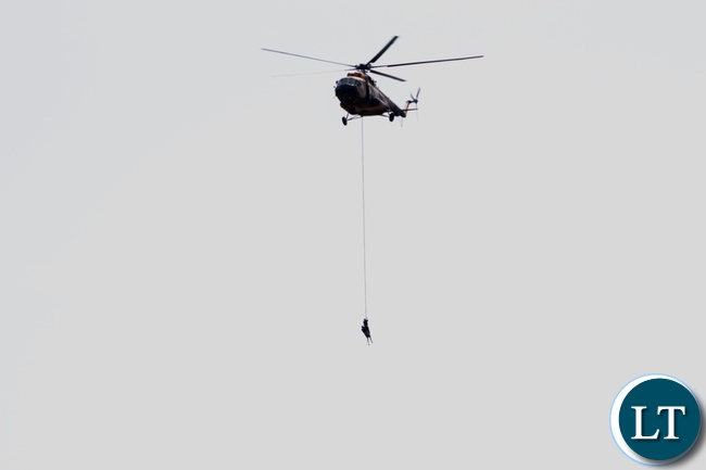 A combined rescue team of Zambia Air Force and Zambia Army Special Forces air lifting some of the 22 Engineering Services Corporation (ESCO) workers who has gotten stuck on the pontoon that was carried away by strong currents towards Ngonye Falls on the Zambezi River in Sioma District
