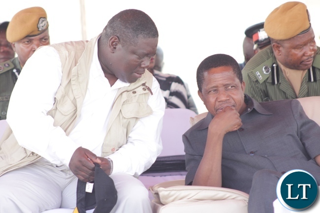 President Edgar Lungu (r) listens from Works and Supply Minister Yamfwa Mukanga (l) during the official commissioning of the Sioma Bridge built at a cost of K108.2million in Sioma District of Western Province President Edgar Lungu (r) listens from Works and Supply Minister Yamfwa Mukanga (l) during the official commissioning of the Sioma Bridge built at a cost of K108.2million in Sioma District of Western Province