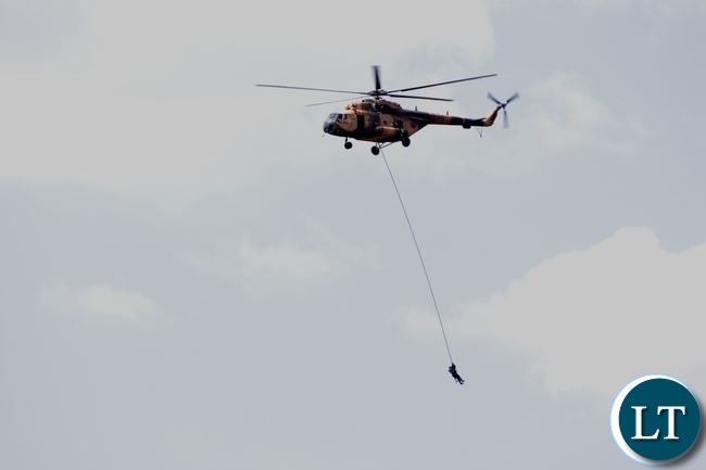 A combined rescue team of Zambia Air Force and Zambia Army Special Forces air lifting some of the 22 Engineering Services Corporation (ESCO) workers who has gotten stuck on the pontoon that was carried away by strong currents towards Ngonye Falls on the Zambezi River in Sioma District