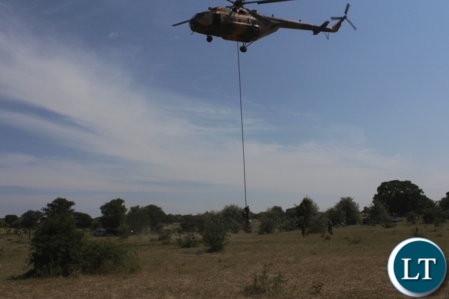 A combined rescue team of Zambia Air Force and Zambia Army Special Forces air lifting some of the 22 Engineering Services Corporation (ESCO) workers who has gotten stuck on the pontoon that was carried away by strong currents towards Ngonye Falls on the Zambezi River in Sioma District