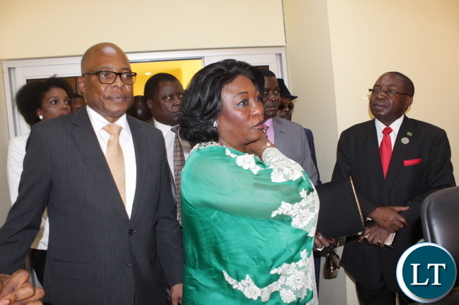 Angolan Ambassador to Zambia Balbina Dias Da Silva (c) and Angolan Secretary General for the Ministry of Foreign Affairs Eduardo De Jesus (l) tours the building as Foreign Affairs Deputy Minister Rayford Mbulu (r) looks on during the Inauguration Ceremony for the Consulate of the Republic of Angola in Mongu