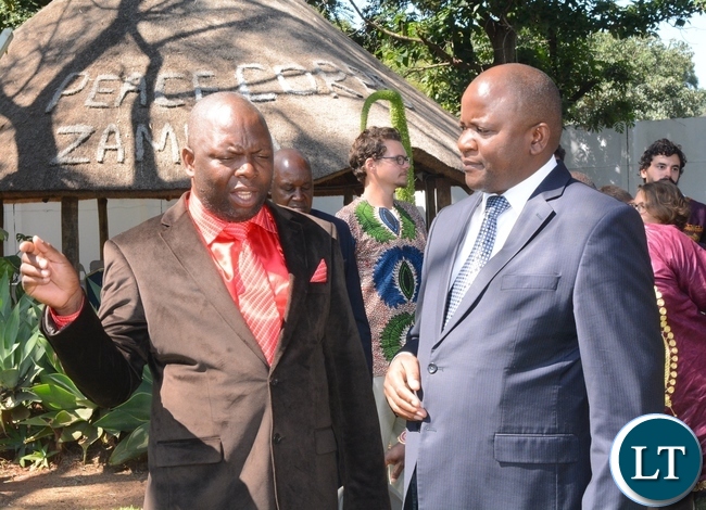His Royal Highness Chief Chamuka of Chisamba District(l) having a light moment with Lands,Natural Resources and Environmental Protection Deputy Minister Davis Mwango(r) immediately after the swearing in ceremony for rural aquaculture promotion and linking income,food and environment project volunteers
