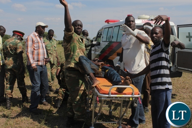 Rescue team attending to a victim of the 22 Engineering Services Corporation (ESCO) workers after air lifting him from the pontoon that was carried away by strong currents and got stuck towards Ngonye Falls on the Zambezi River in Sioma District