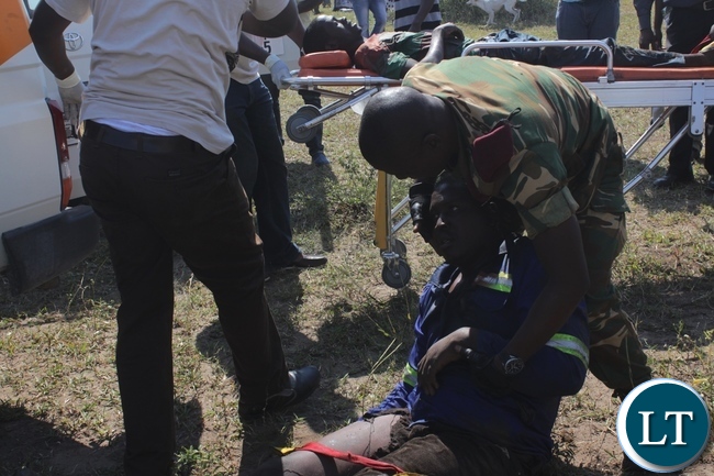 Zambia Army Special Forces attending to a victim of the 22 Engineering Services Corporation (ESCO) workers after air lifting him from the pontoon that was carried away by strong currents and got stuck towards Ngonye Falls on the Zambezi River in Sioma District