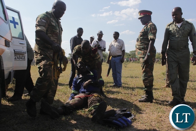 Zambia Army Special Forces attending to a victim of the 22 Engineering Services Corporation (ESCO) workers after air lifting him from the pontoon that was carried away by strong currents and got stuck towards Ngonye Falls on the Zambezi River in Sioma District