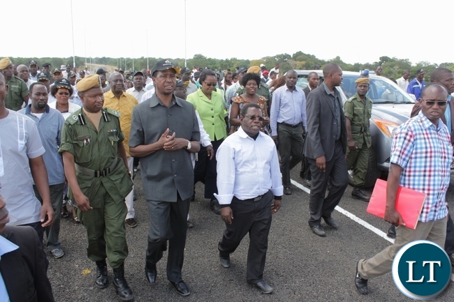 President Edgar Lungu (c) flanked by his entourage tours the Sioma Bridge built at a cost of K108.2million after officially commissioning it in Sioma District of Western Province,