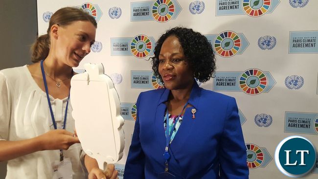 Christine Kalamwina at Paris Agreement signing ceremony