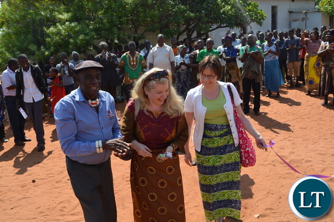 (from Left to Right) Chief Mukuni of the Toka Leya of Kazungula District, Global Dry Toilet Association of Finland (GDTAF) Project Manager Sari Huuhtanen and Ministry for Foreign Affairs Finland Programme Officer Sirpa Rajasarkka cut the ribbon during the handover ceremony of Dry Toilets in Mukuni Village