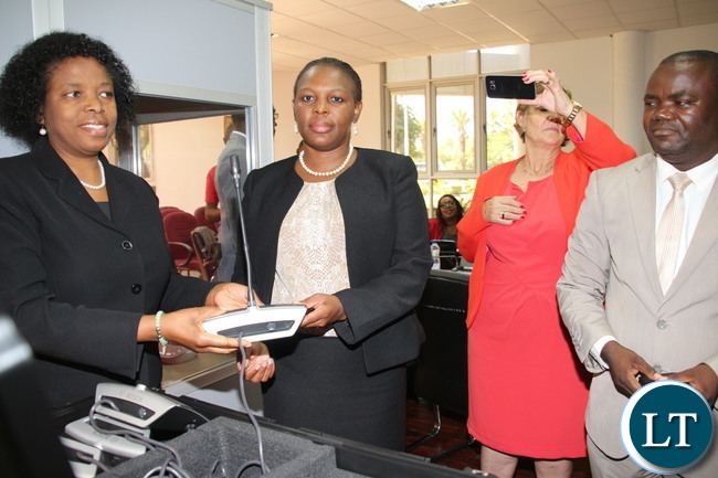 Ministry of Finance Budget and Economic Affairs Permanent Secretary Mrs Pamela Kabemba and National Assembly of Affairs Mrs Cecilia Mbewe receiving the “Communication Kit” that was used during the Inter parliament Union Assembly in Lusaka; the kit was handed over to the National assembly of Zambia