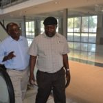 State House Special Assistant for Project Monitoring and Implementation Lucky Mulusa (right) with Ndilila Associates director Francis Ndilila (left) leaving the elevators during a tour of International Bus Terminus currently under construction in Livingstone