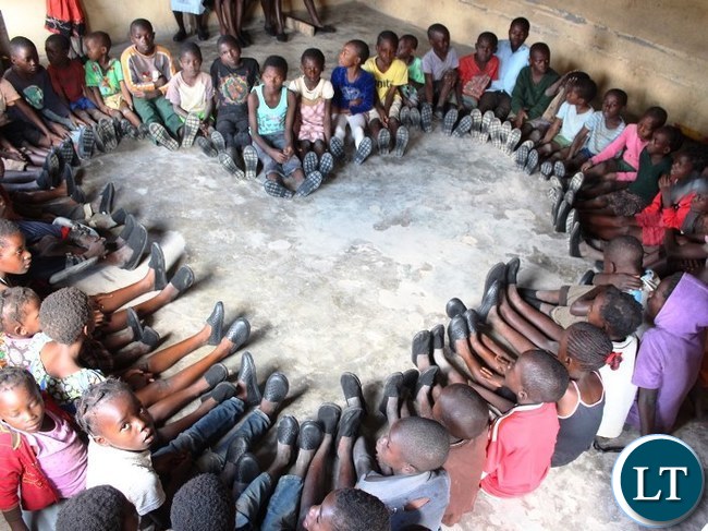 Ubulayo Charity organization founder Tasila Lungu with Mervis Chanda 8, a pupil at Mipango Community School in Mungwi district during her tour of Northern Province. This was after she made a donation of shoes to over 200 vulnerable and orphaned pupils at the school. Ubulayo Charity organization founder Tasila Lungu with Mervis Chanda 8, a pupil at Mipango Community School in Mungwi district during her tour of Northern Province. This was after she made a donation of shoes to over 200 vulnerable and orphaned pupils at the school.