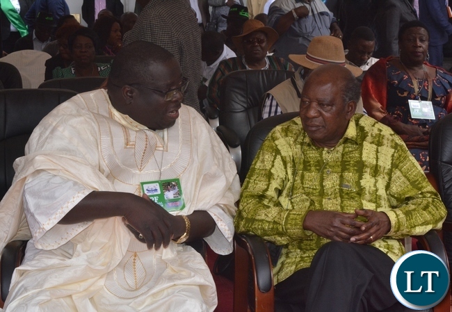 -Minister of Information and Broadcasting Services Chishimba Kambwili(l) and Minister of Finance Alexander Chikwanda(r) chats during the Launch of the PF Campaign at Heroes Stadium -Minister of Information and Broadcasting Services Chishimba Kambwili(l) and Minister of Finance Alexander Chikwanda(r) chats during the Launch of the PF Campaign at Heroes Stadium
