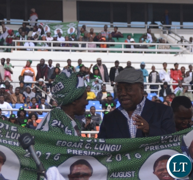 Vice President Inonge Wina(l) chats with the fourth Republican President Lupiya Banda(r) after launching the PF chitenge during the Launch of the PF Campaign at Heroes Stadium