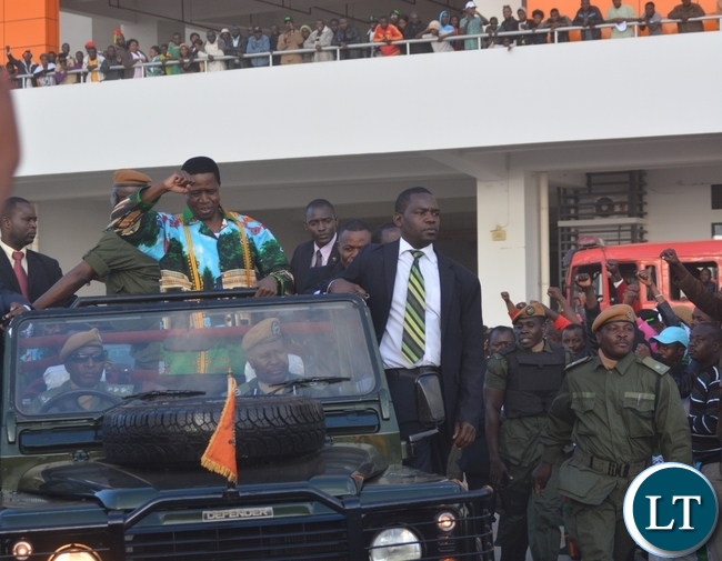 President Edgar Lungu flashing the PF symbol as he was leaving Heroes Stadium after launching the PF campaign at Heroes Stadium