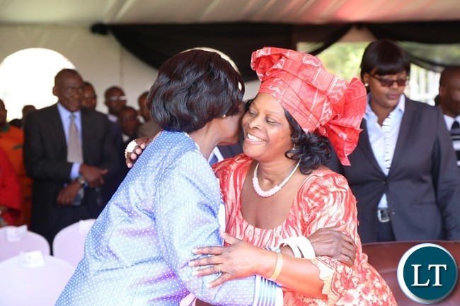 First Lady Esther Lungu(r) being welcomed by Vice President Inonge Wina(l) during the celebration of Africa Freedom day at State House