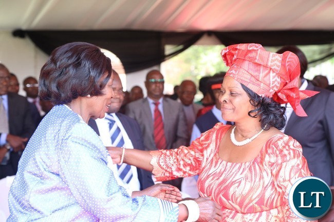 First Lady Esther Lungu(r) being welcomed by Vice President Inonge Wina(l) during the celebration of Africa Freedom day at State House