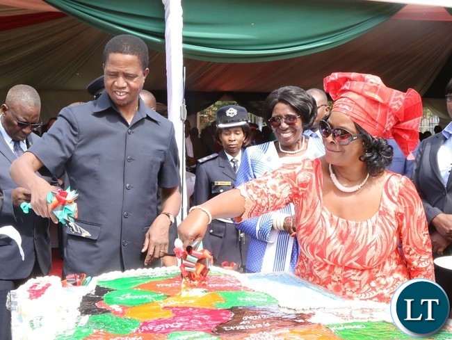 President Edgar Lungu(l) and his First Lady Esther Lungu(r) cutting the Africa Freedom day cake while the Vice President Inonge Wina looks on during the celebration of Africa Freedom