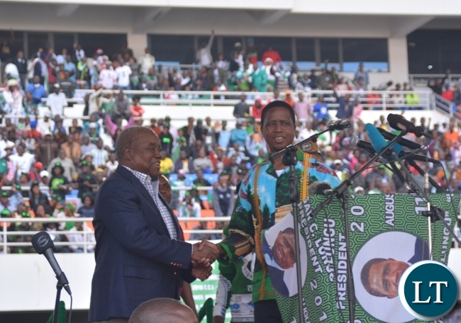 President Edgar Lungu(r) welcoming the fourth Republican President Lupiya Banda(l) to the Launch of the PF Campaign at Heroes Stadium