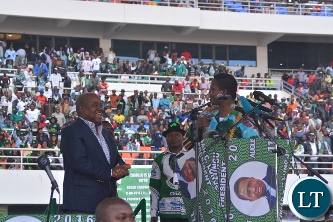 President Edgar Lungu(r) having a light moment with the fourth Republican President Lupiya Banda(l) after welcoming him to the Launch of the PF Campaign at Heroes Stadium