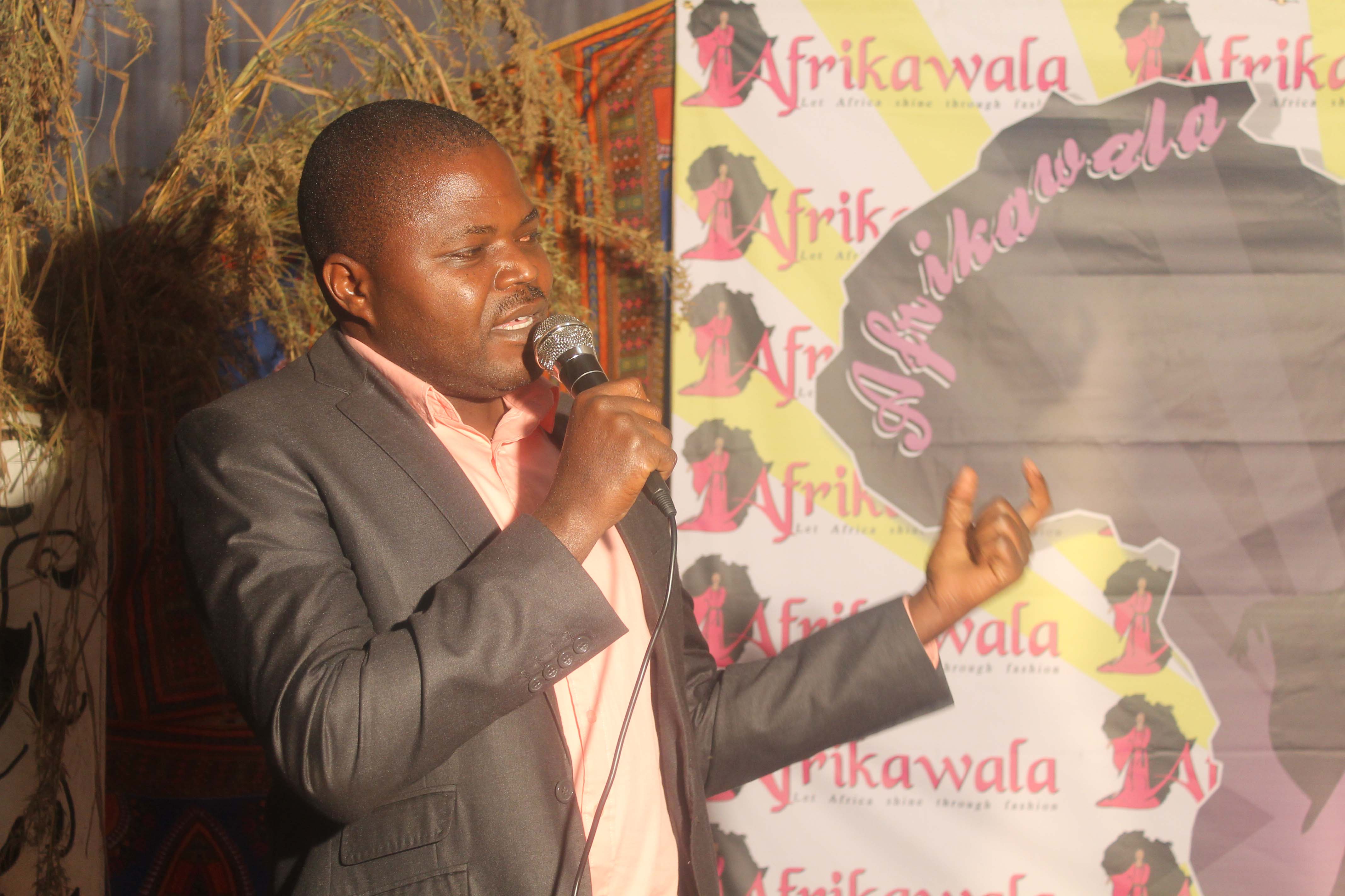 Acting District Administrative Officer Mr Morris Kabanda speaks during the fashion show