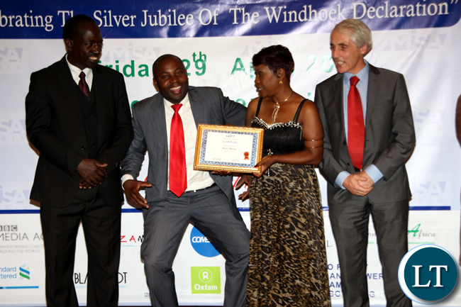 Blogger and media trainer Richard Mulonga poses for a photograph after receiving special recognition for best community blog during the 2016 MISA Zambia annual awards in Lusaka on April 29, 2016.