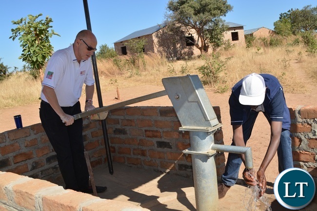 Response Network Country Director Hakon Spigseth inspects a borehole donated by his organisation during the Ground Breaking ceremony for Tore Schulze Memorial School in Zimba, Southern Province.