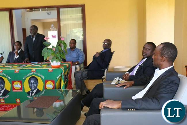 Mulenga Sata and other UPND officials listening to Mr Mpombo at HH's residence