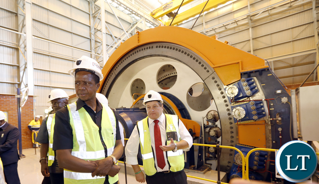 President Lungu tour Synclinorium Shaft at Mopani operation room operates the Shaft gear in the Control Room0576