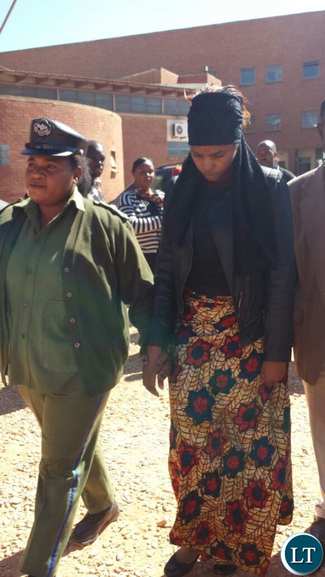 Murder suspect Precious being led out of court