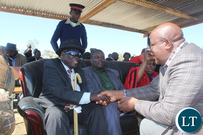 Southern Province permanent secretary Mr Sibanze Simuchoba (right) greets Senior Chief Monze(left) while Chief Chikanta ( seated in the middle)of Choma District and the host Chieftainess Choongo ( seated left)looks on during the inaugural Samu Lya Moomba Lwiindi Traditional Ceremony of the Tonga speaking people of Choongo Chiefdom Southern Province permanent secretary Mr Sibanze Simuchoba (right) greets Senior Chief Monze(left) while Chief Chikanta ( seated in the middle)of Choma District and the host Chieftainess Choongo ( seated left)looks on during the inaugural Samu Lya Moomba Lwiindi Traditional Ceremony of the Tonga speaking people of Choongo Chiefdom