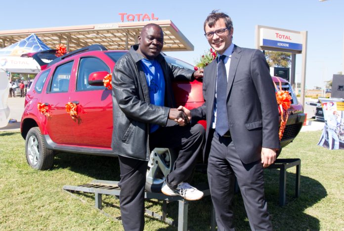 Winner of a brand new US$29,000 Renault Duster, Robinson Kabamba with Total Zambia managing director Damien Ricour-Dumas. Picture courtesy of KPR Consulting