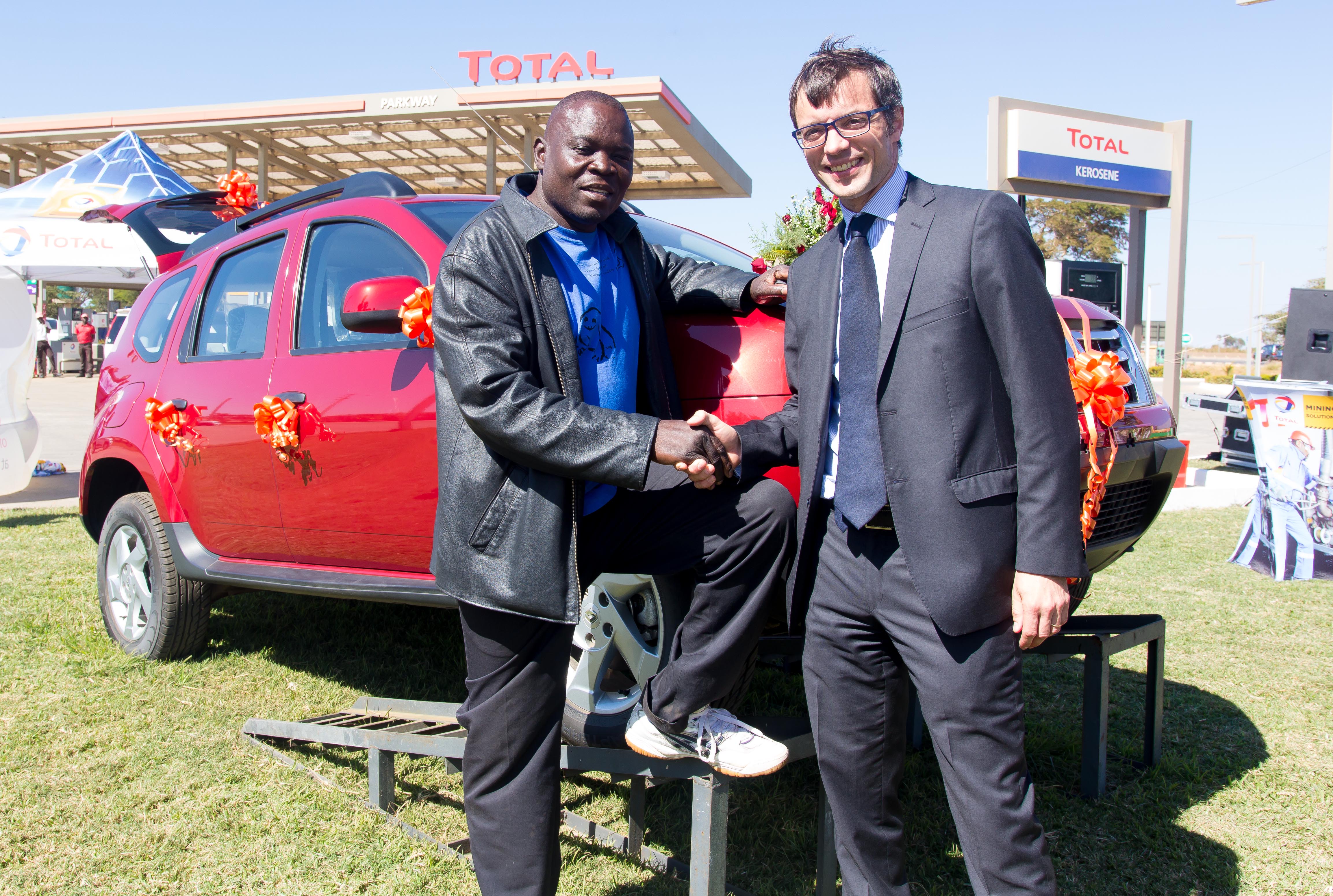 Winner of a brand new US$29,000 Renault Duster, Robinson Kabamba with Total Zambia managing director Damien Ricour-Dumas. Picture courtesy of KPR Consulting