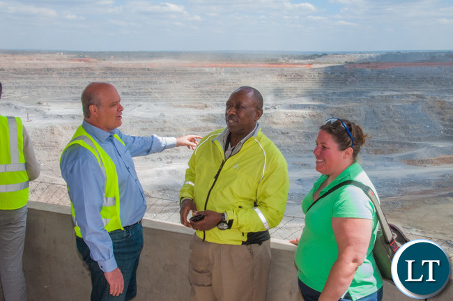 Head of the Office of the High Commission of Canada in Lusaka Amy Galigan, right, views First Quantum Minerals' Kansanshi mine with Kansanshi Public Relations Manager Godfrey Msiska (centre) and European Union Ambassador and Head of Delegation Alessandro Mariani.