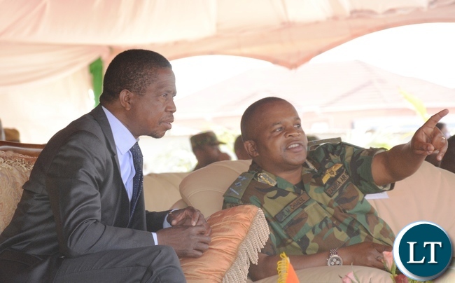 Zambia Air force Commander Lt Gen Eric Chimese(r) points where the Hospital is while President Lungu(l) looks on at Zambia Air Force Headquarters during the official opening of Zambia Air Force Hospital