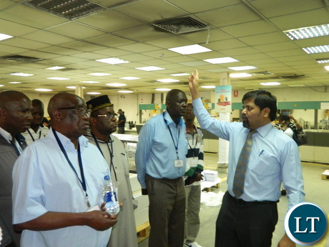 Al Ghurair Printing and Publishing General Manager Lakshmanan Ganapathy explains the printing process in the plant to the Zambian team which is in Dubai to observe the printing of ballot papers for the August 11, 2016 general elections.