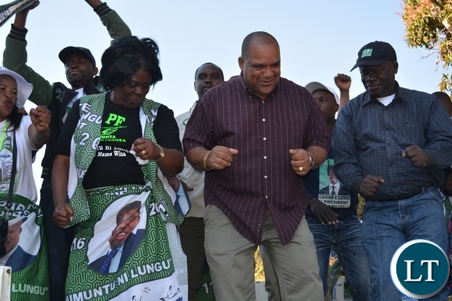 Tourism and Arts minister Jean Kapata,Livestock and Fisheries deputy minister Lawrence Evans and PF Livingstone District vice chairperson John Mukosho dancing to Dununa reverse during a PF rally at Maramba Old People's Home grounds in Livingstone