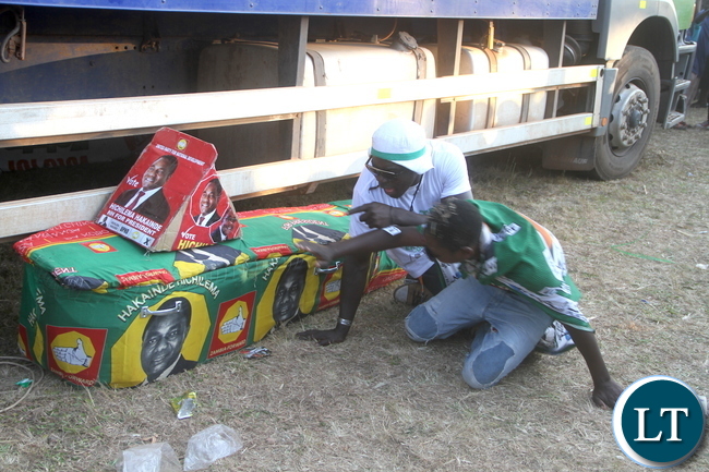 PF cadres displays a mock coffin of Opposition UPND party leader Hakainde Hichilema and his running mate Geoffrey Bwalya Mwamba in Kasama on Tuesday, July 19,2016 -Picture by THOMAS NSAMA