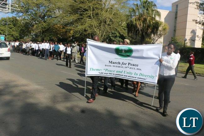 Marchers troop out of the Cathedral to embark on a peace march organised by LAZ