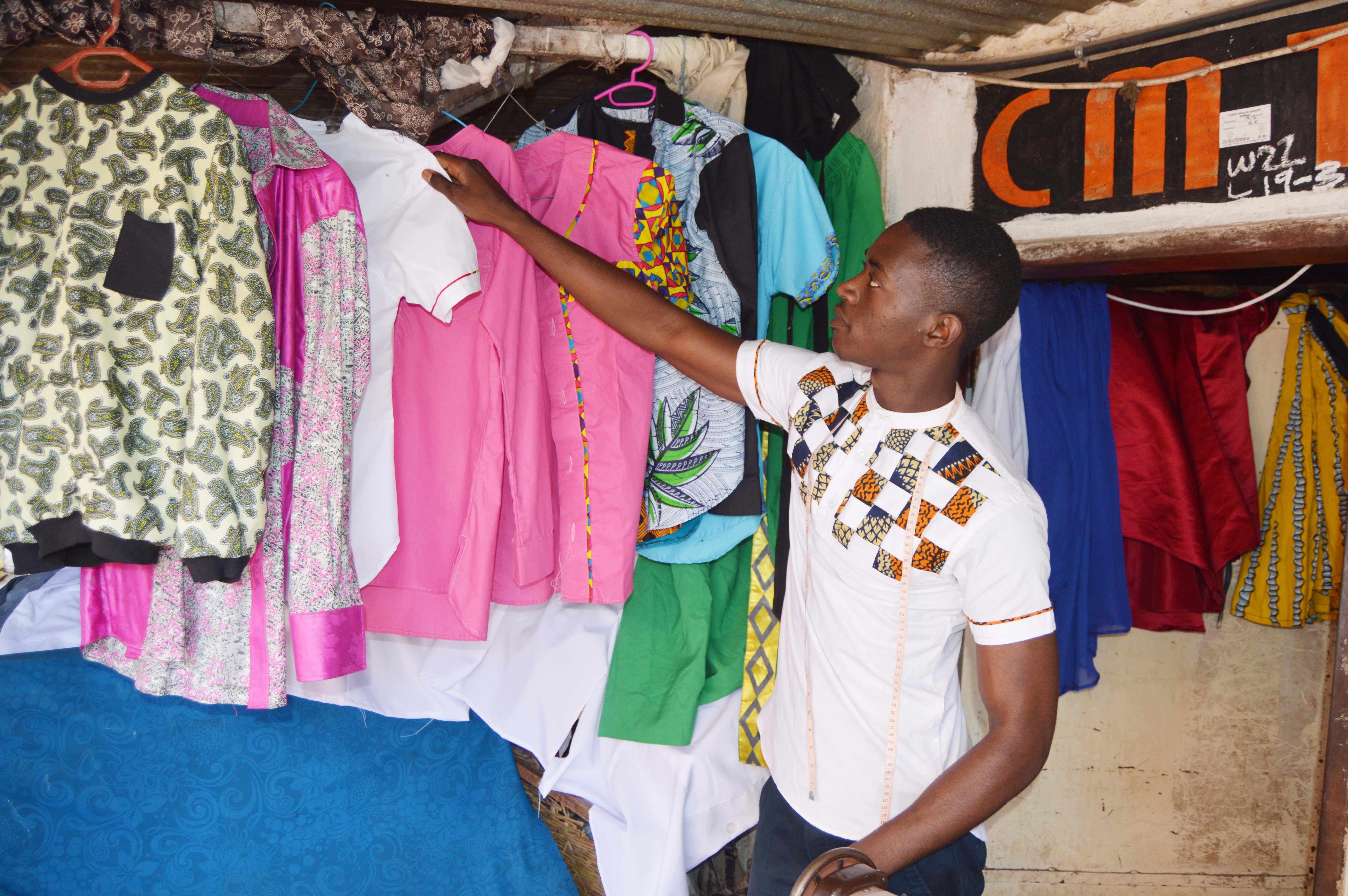 Designer and Tailor Mark Mafuleka displaying some of his designs at his shop at Normead Market in Lusaka, Zambia. Picture by Hope Mkunte