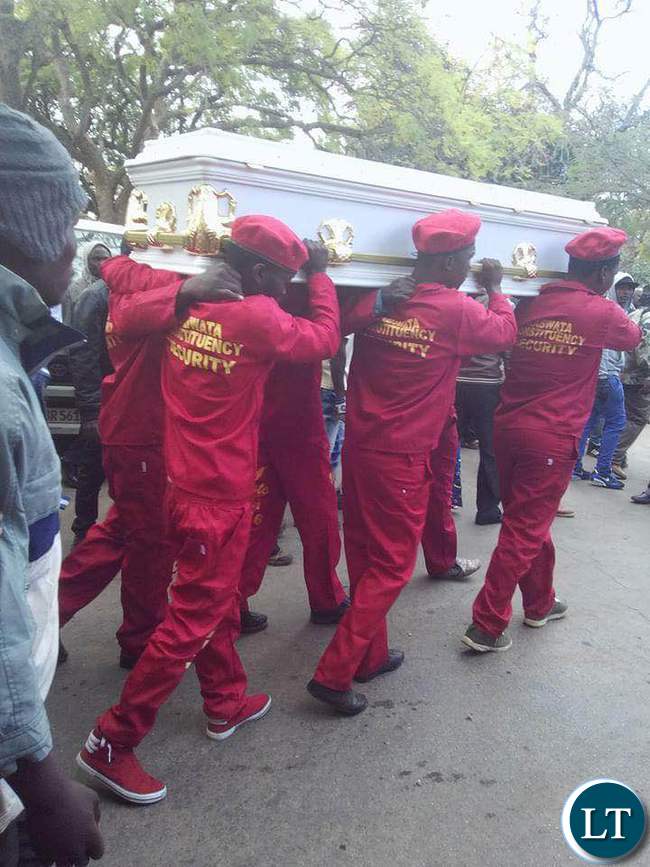 Pall bearers carrying Mapenzi's coffin